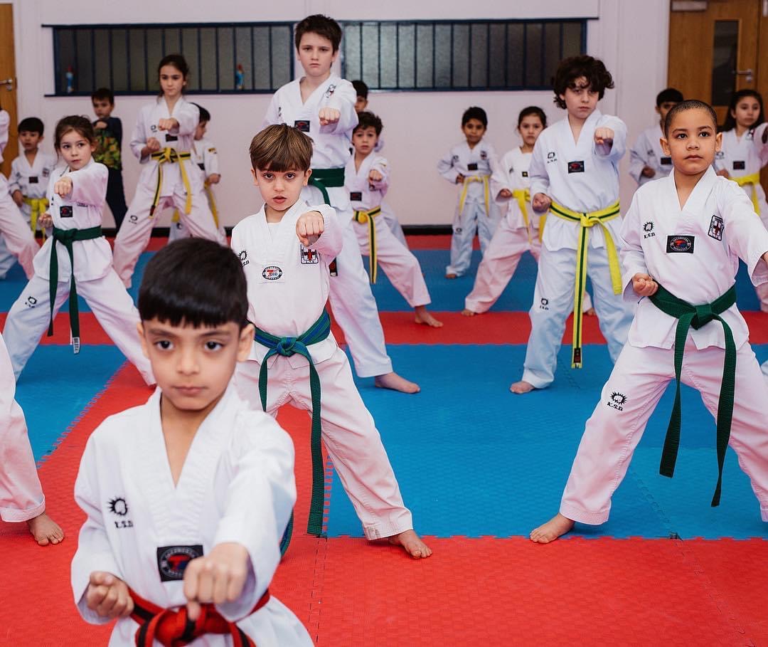 Cadets holding a punch stance in unison during class