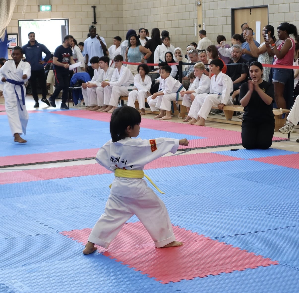 A young Little Panther performing a pattern on the competition mat
